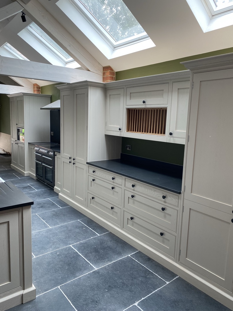 Willerby Lodge — cabinetry run with plate rack and range cooker