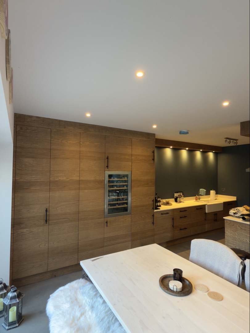 Watermill Lodge — wide kitchen wall view with stained oak cabinetry