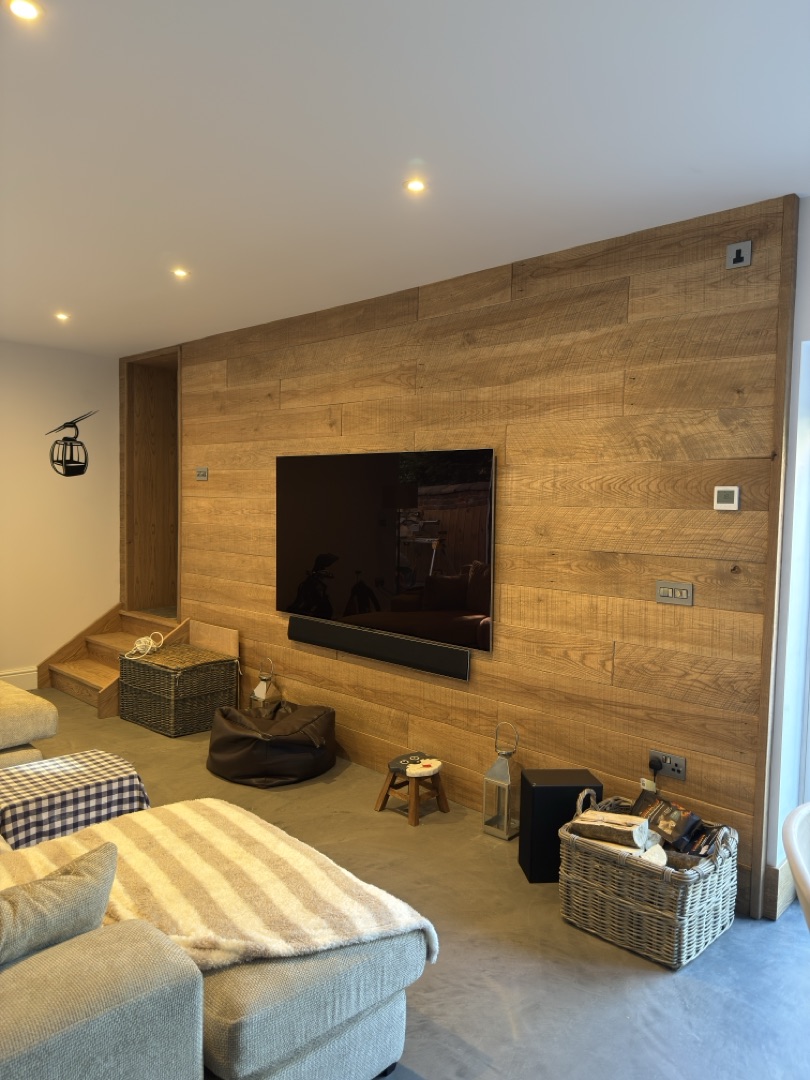 Watermill Lodge — bespoke oak media wall with mounted TV and sound bar