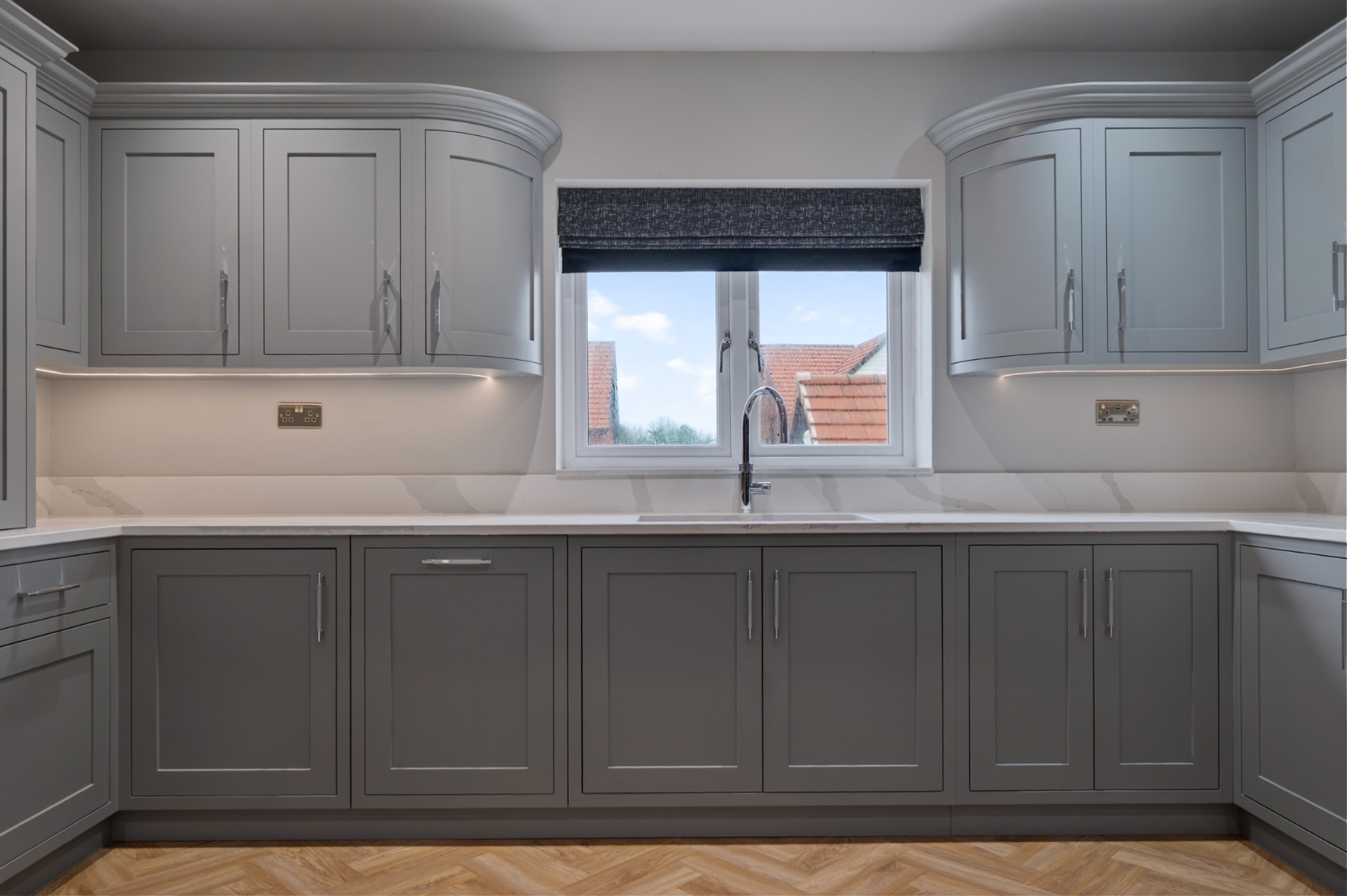 Belvedere Parade — symmetrical sink view with curved wall units