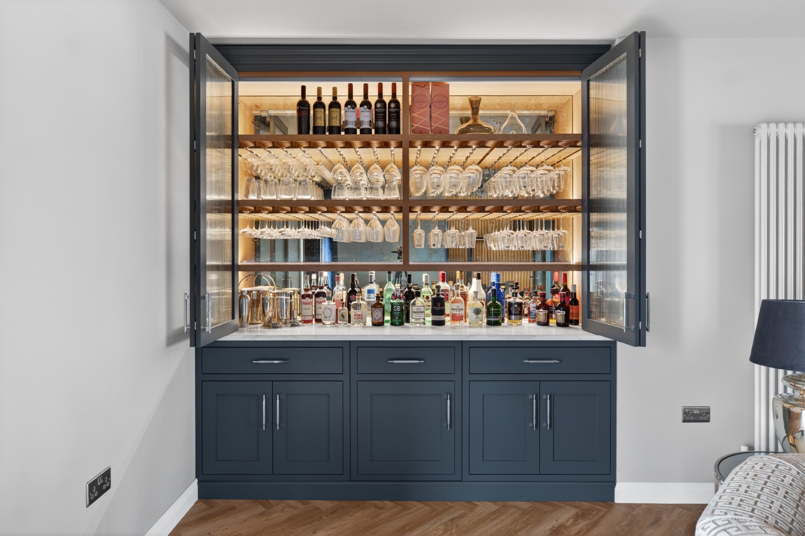 Belvedere Parade — drinks cabinet open showing full bar display
