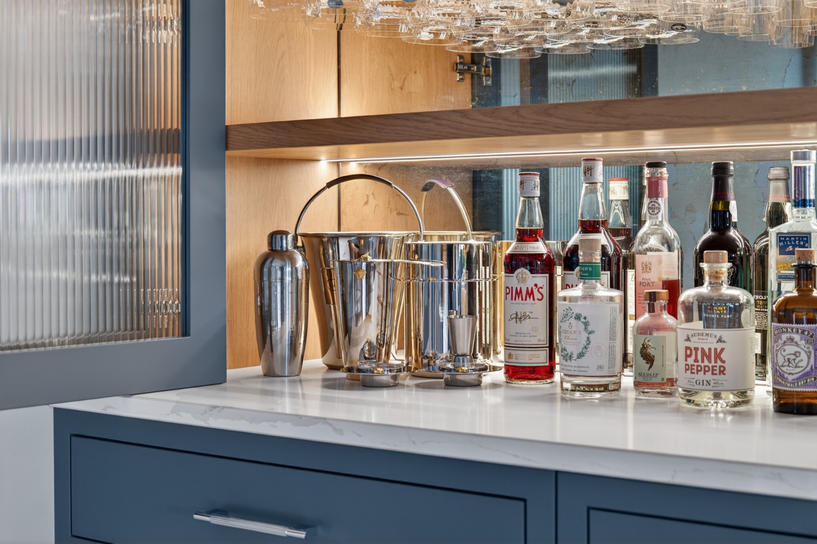 Belvedere Parade — drinks cabinet detail with marble surface and glassware