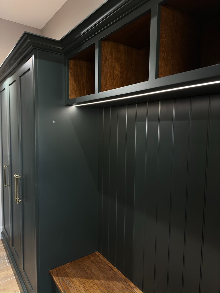 The Stables — boot room LED lighting illuminating tongue-and-groove panelling