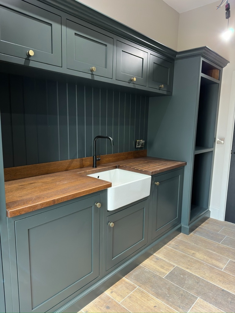 The Stables — utility room wider view with open shelving and Belfast sink