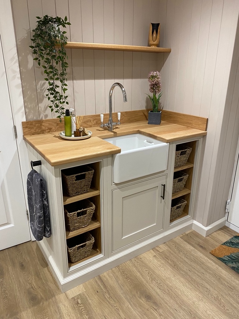 Bespoke utility room with Belfast sink, oak worktop, wicker basket storage and open shelving